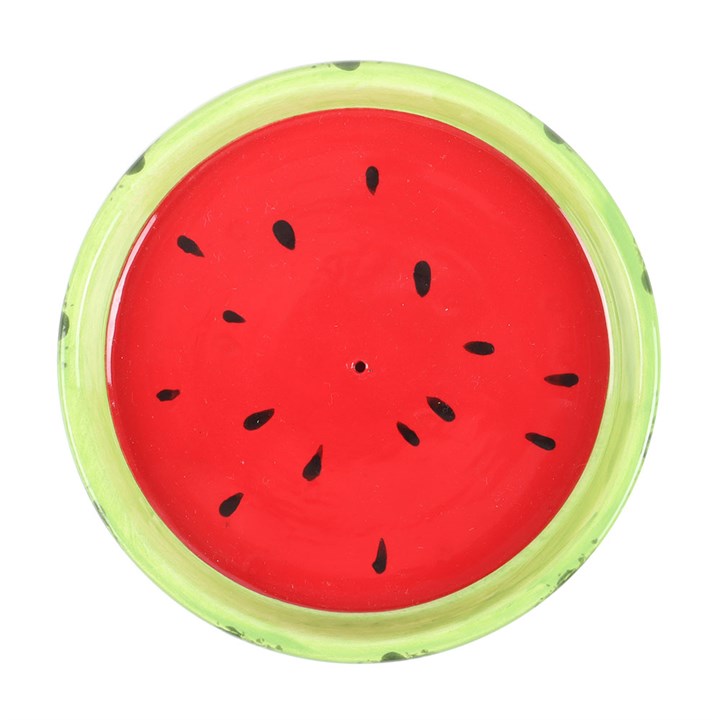 Round watermelon-themed incense holder with red center and green rim on a white background