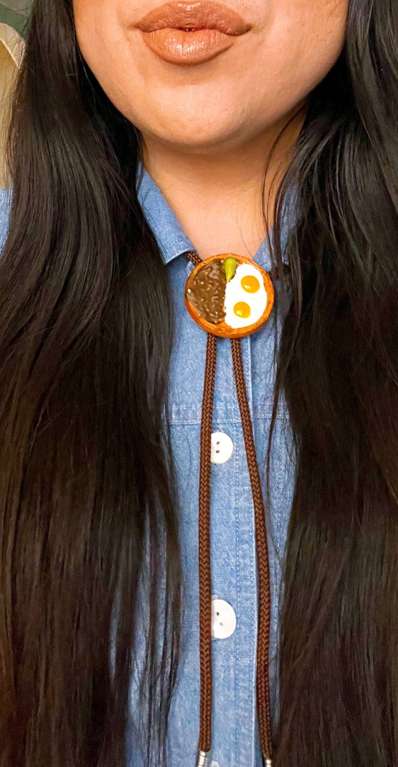 Bolo ties with traditional Mexican food plates styled with jean top