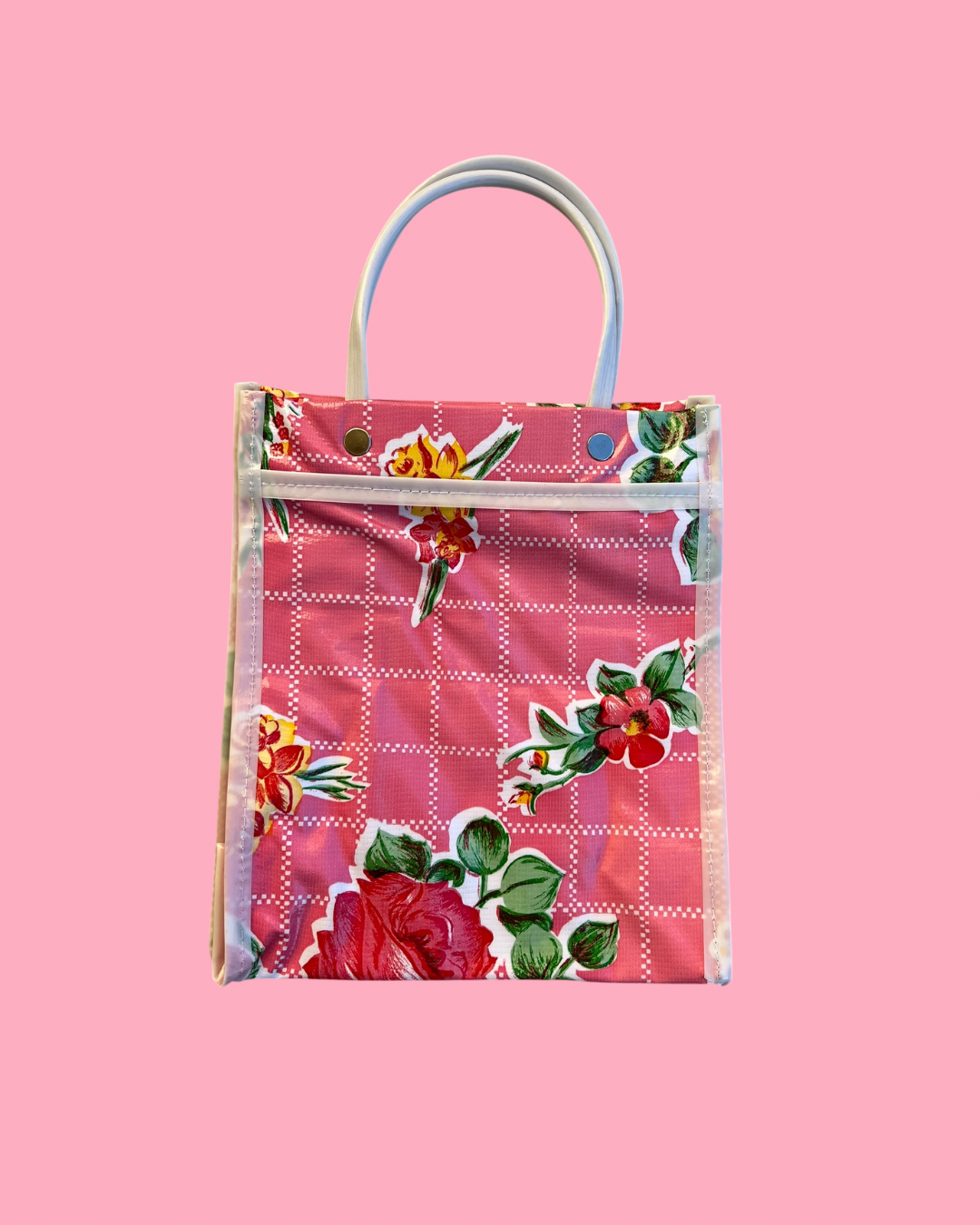 Floral-patterned bag on a pink background