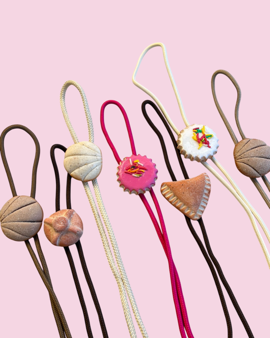 Pan Dulce Bolo Ties on pink background