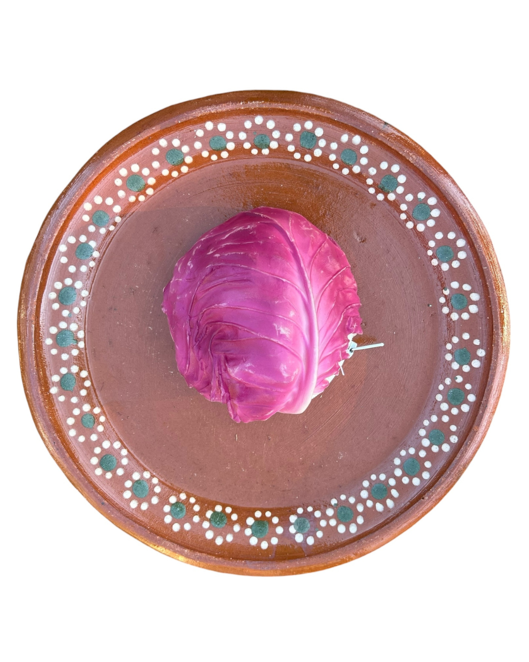 Ceramic plate with decorative border featuring a purple cabbage coin purse on a white background